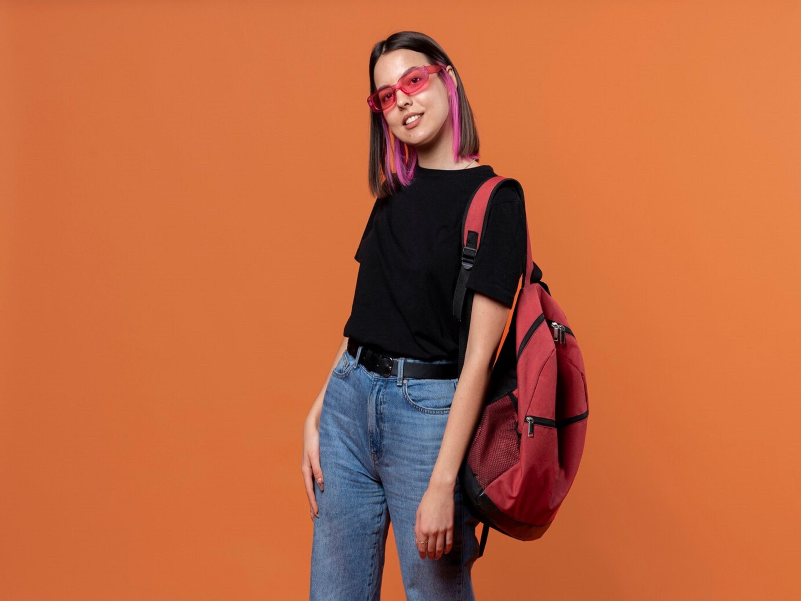 portrait-young-girl-wearing-sunglasses-holding-her-backpack_23-2149260608